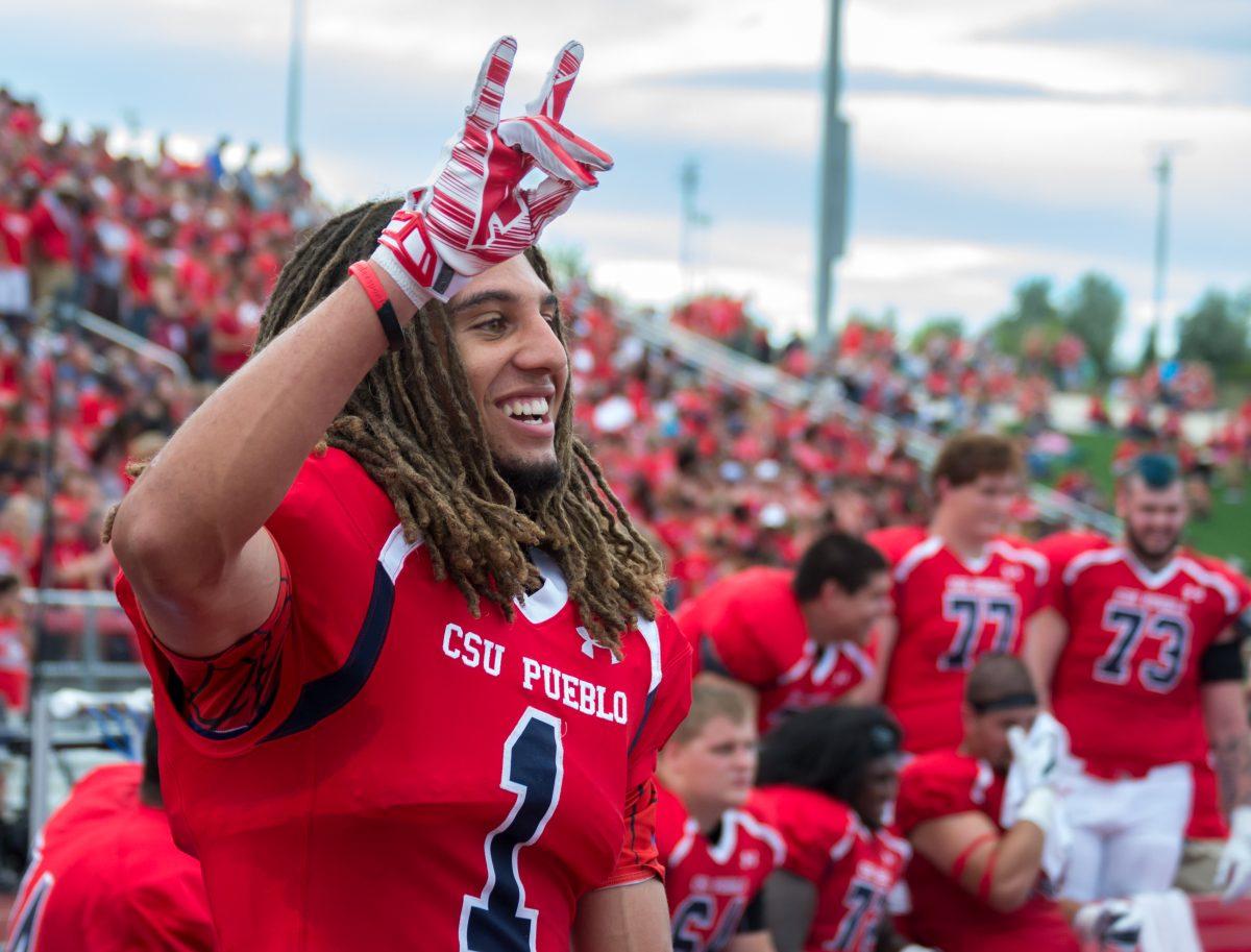 Wide Receiver, Kieren Duncan, shows his pack pride after a scoring play on Saturday. Photo by Dustin Cox