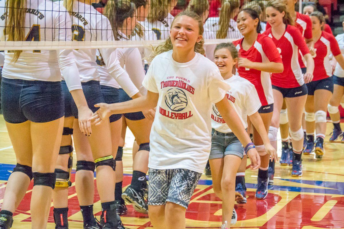 Paige and Shannon Vrana were welcomed to the CSU-Pueblo volleyball team as honorary members after losing their mother. | Photo by Dustin Cox.