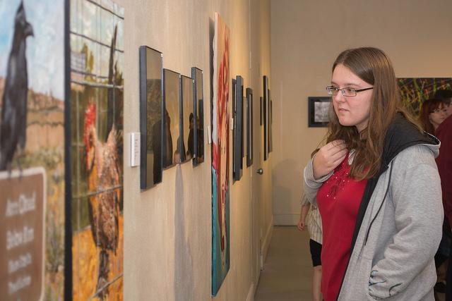 Student+attendee+appreciating+art+at+the+annual+CSU-Pueblo+Student+Art+Show