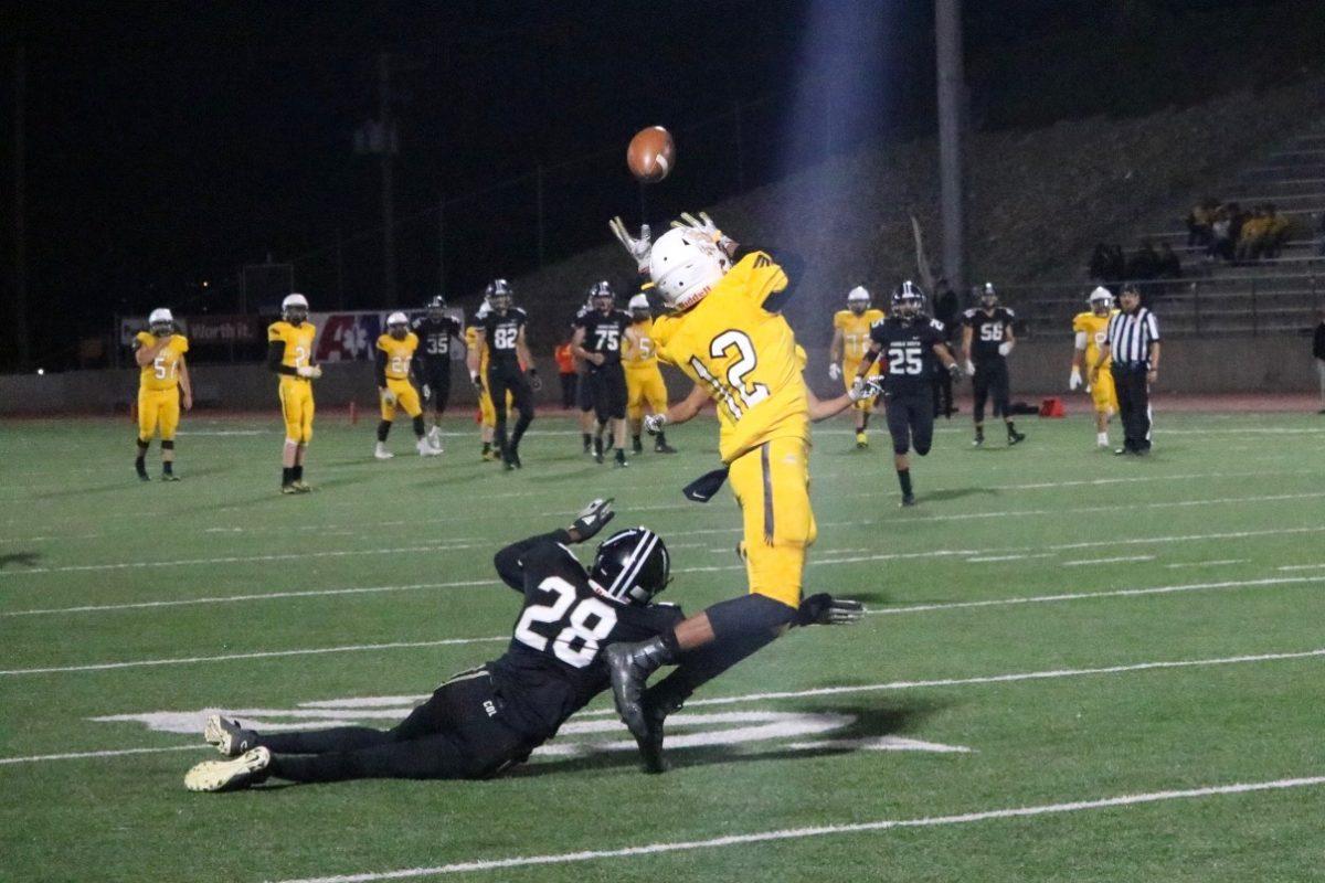 East+Eagles+sophomore+Jaxon+Herring+%2812%29+reaches+out+for+a+pass+at+Dutch+Clark+Stadium.+Photo+by+Dez+Rowe