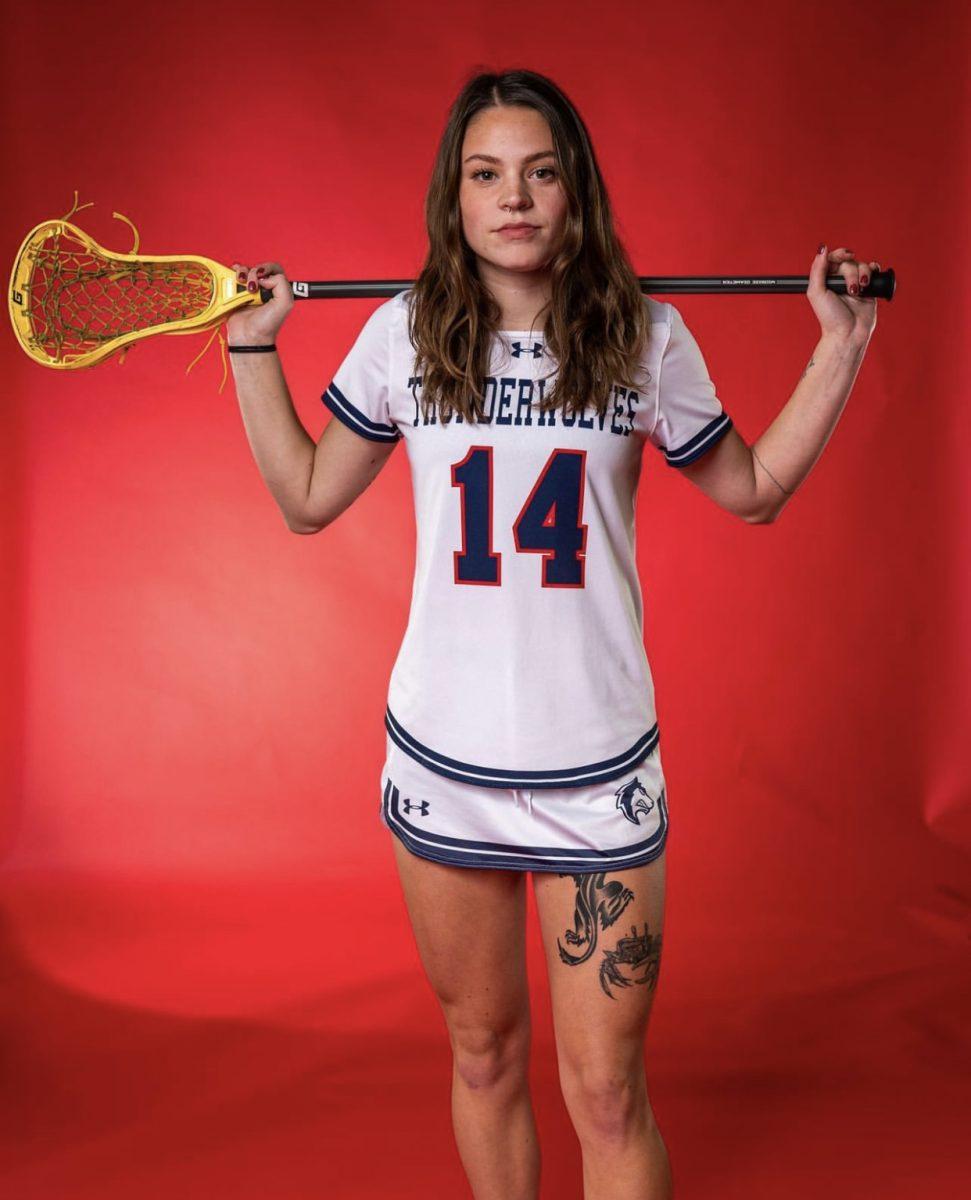 Senior Caira Lessick, #14, poses with a lacrosse stick during the CSU Pueblo Womens Lacrosse media day. Photo provided by Jayson Ortiz.