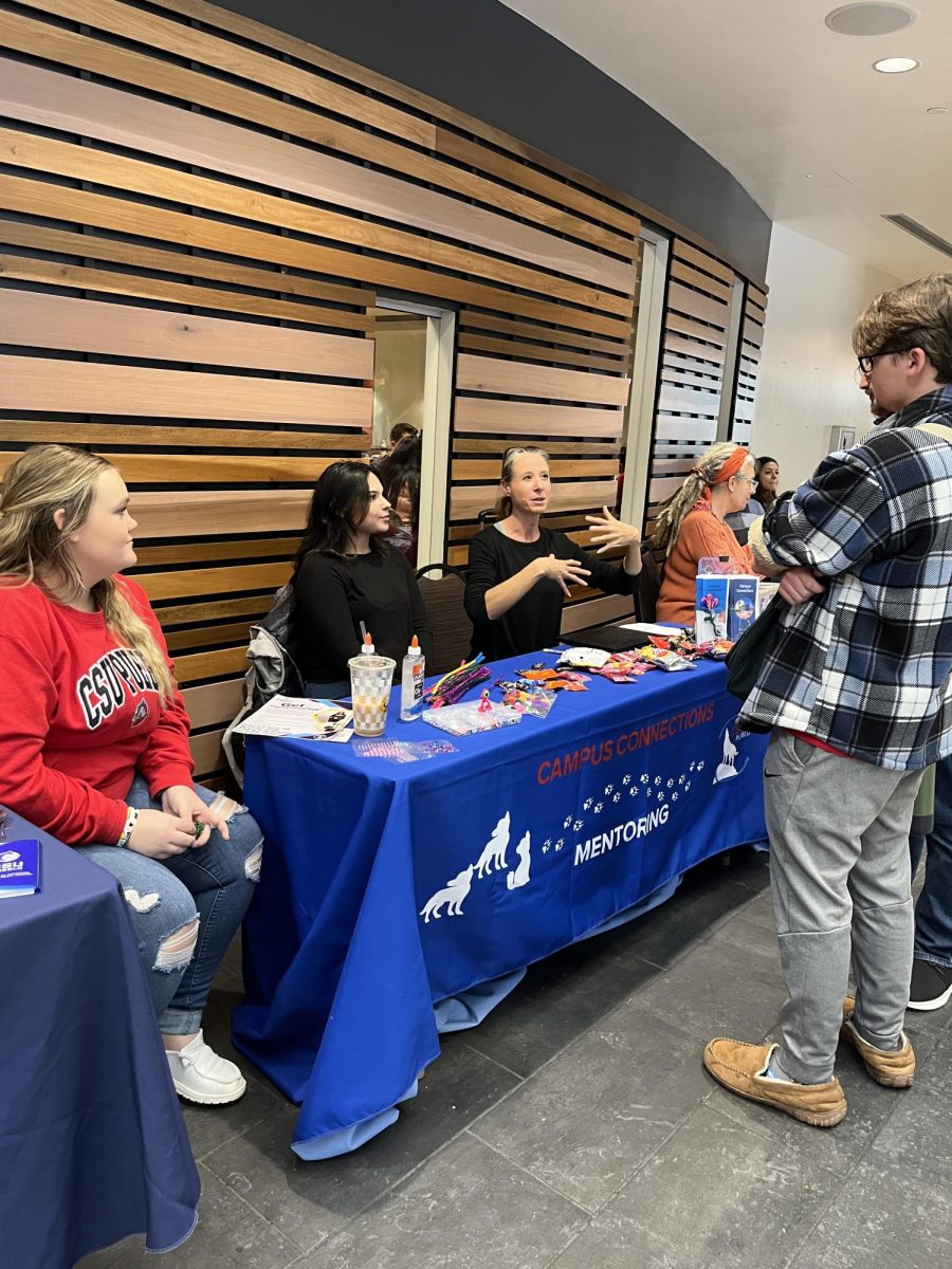 Staff and student workers talk to students about Campus Connections at the PAWS EXPO campus and community resource fair. (Photo by Holly Ward)