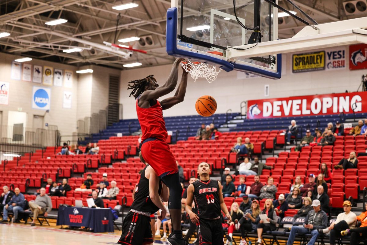 CSU Pueblo's, Victor Lado, dunks in game against Barclay College, helping the Pack win 109-50. (Photo by Ashlyn Drury)