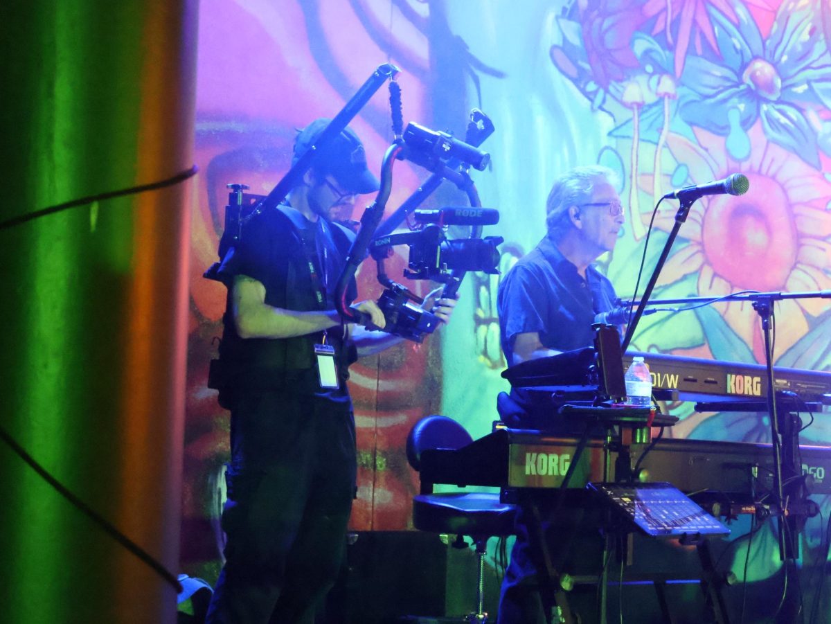Media & Entertainment student Carlyle Murley is shown using the RODE body camera to capture Cody Cozz and his band’s performance at the Steel City Music Showcase on April 11th. 