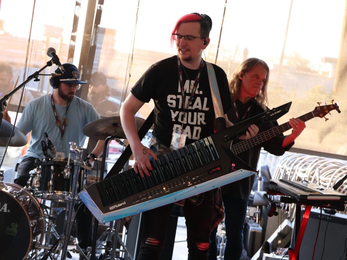 The keyboardist for the band: "OZONIC" is shown performing at the Gold Dust stage during his group’s performance  at the Steel City Music Showcase on April 11th. 