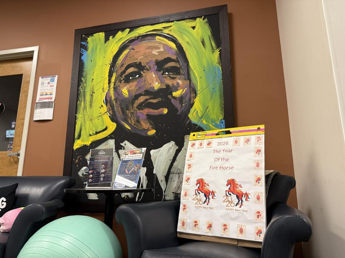 A painting and sign inside the Center for Student Support and Advocacy (Photo by Emma Harry).