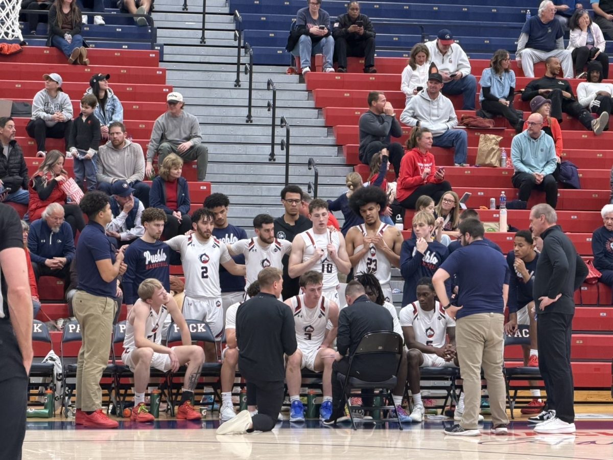 Coach Ruebesam debriefing his players in the second half (photo by Gio Alfonso).