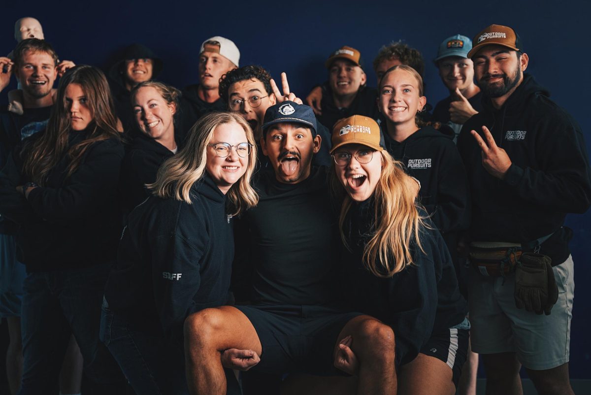 Aaron Garcia (center) held aloft by Kaitlyn Davis (right) (photo courtesy of Outdoor Pursuits).