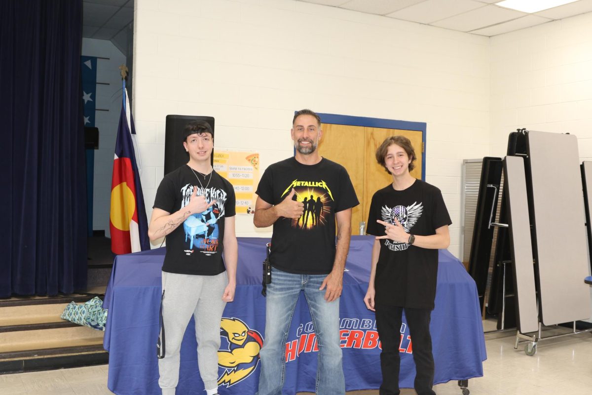 Gio Alfonso, Principal Jimmie Pool, and Donovan Trujillo before the assembly (photo taken by Ashley Hughes).