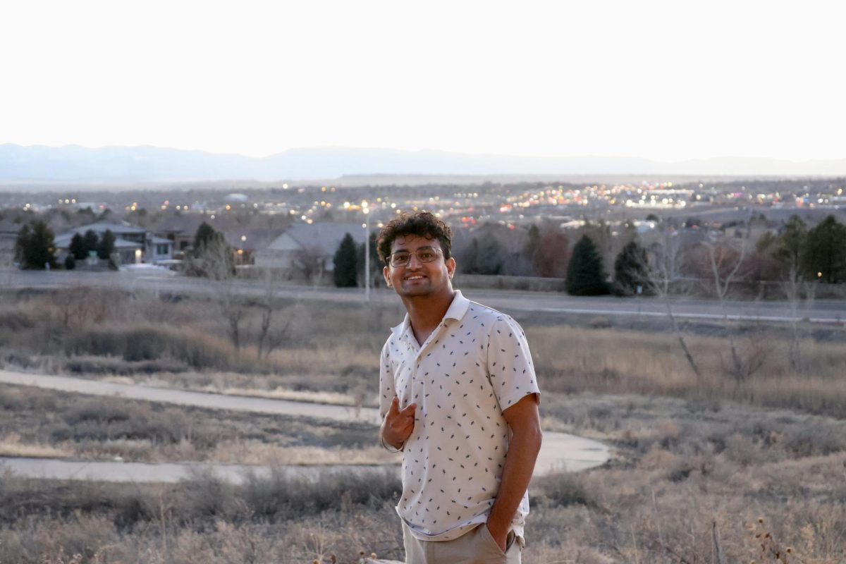 Mahesh Sharma posing for the camera outside his Walking Stick apartment (photo by Archie Wyatt).